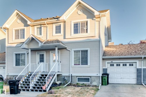 Traditional-style home featuring a garage and concrete driveway - #48 - 2503 24 Street Nw, Edmonton, AB - Outdoor With Facade