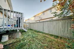 Fenced backyard featuring a deck - 