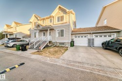 Traditional-style house with concrete driveway and a garage - 