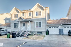 Traditional-style home with concrete driveway - 
