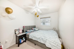 Bedroom featuring carpet floors and ceiling fan - 