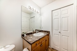 Bathroom with vanity and a textured ceiling - 