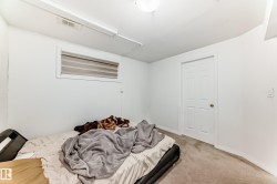 Carpeted bedroom featuring baseboards - 