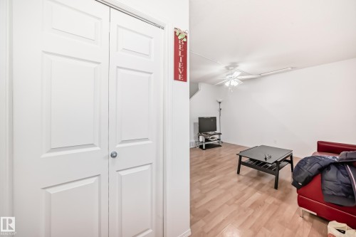 Sitting room featuring light wood finished floors and ceiling fan - #48 - 2503 24 Street Nw, Edmonton, AB - Indoor Photo Showing Other Room