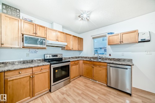 #48 - 2503 24 Street Nw, Edmonton, AB - Indoor Photo Showing Kitchen With Double Sink