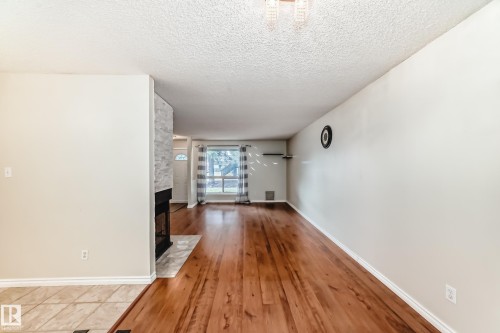 1126 Saddleback Road, Edmonton, AB - Indoor Photo Showing Other Room With Fireplace