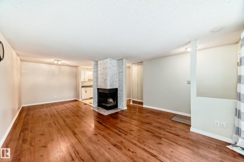 1126 Saddleback Road, Edmonton, AB - Indoor Photo Showing Living Room With Fireplace