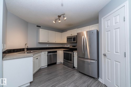 1 150 Edwards Drive, Edmonton, AB - Indoor Photo Showing Kitchen With Double Sink