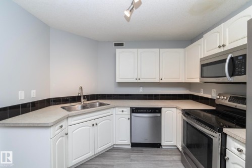 1 150 Edwards Drive, Edmonton, AB - Indoor Photo Showing Kitchen With Double Sink