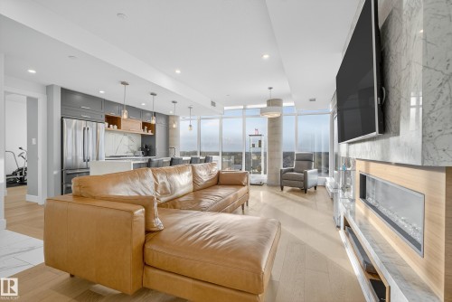 602 14105 West Block Drive, Edmonton, AB - Indoor Photo Showing Living Room With Fireplace