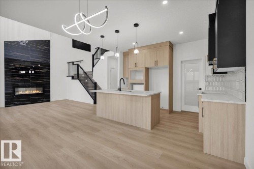 3904 41 Avenue, Beaumont, AB - Indoor Photo Showing Kitchen With Fireplace