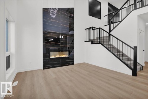 3904 41 Avenue, Beaumont, AB - Indoor Photo Showing Other Room With Fireplace