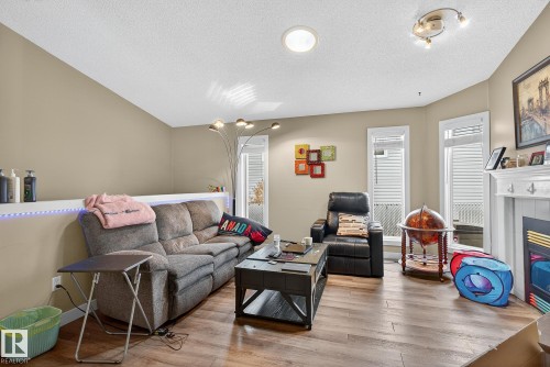 55 Mcleod Crescent, Leduc, AB - Indoor Photo Showing Living Room With Fireplace