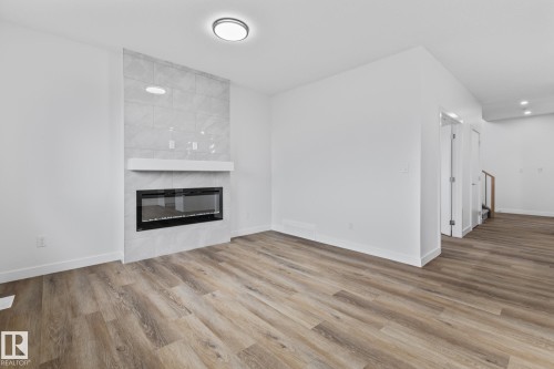 68 Waverly Way, Fort Saskatchewan, AB - Indoor Photo Showing Living Room With Fireplace