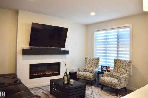 38 Wiltree Terrace, Fort Saskatchewan, AB - Indoor Photo Showing Living Room With Fireplace