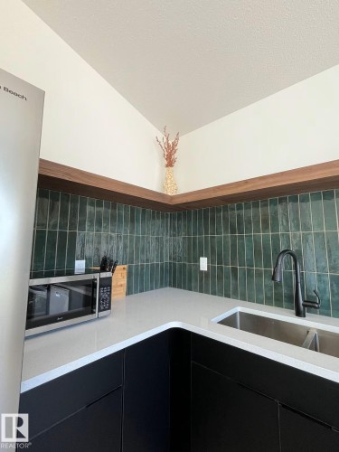 10711 76 Avenue, Edmonton, AB - Indoor Photo Showing Kitchen With Double Sink