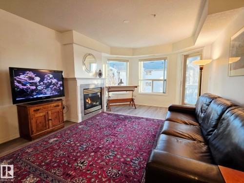 327 6703 172 Street, Edmonton, AB - Indoor Photo Showing Living Room With Fireplace