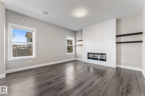 9 Spring Link, Spruce Grove, AB - Indoor Photo Showing Living Room With Fireplace