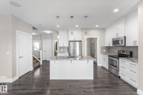 9 Spring Link, Spruce Grove, AB - Indoor Photo Showing Kitchen With Stainless Steel Kitchen With Upgraded Kitchen