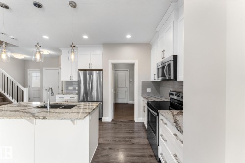 9 Spring Link, Spruce Grove, AB - Indoor Photo Showing Kitchen With Stainless Steel Kitchen With Upgraded Kitchen