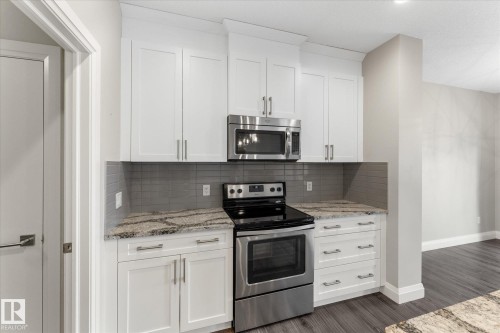 9 Spring Link, Spruce Grove, AB - Indoor Photo Showing Kitchen With Stainless Steel Kitchen With Upgraded Kitchen