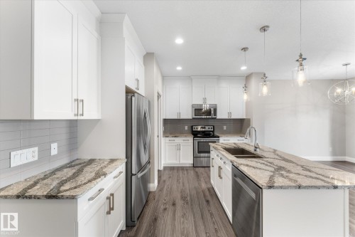 9 Spring Link, Spruce Grove, AB - Indoor Photo Showing Kitchen With Stainless Steel Kitchen With Double Sink With Upgraded Kitchen