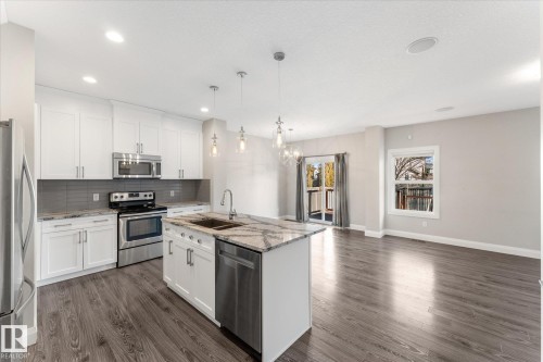 9 Spring Link, Spruce Grove, AB - Indoor Photo Showing Kitchen With Stainless Steel Kitchen With Double Sink With Upgraded Kitchen