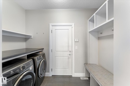 9 Spring Link, Spruce Grove, AB - Indoor Photo Showing Laundry Room