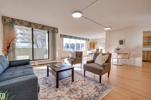 205 8340 Jasper Avenue, Edmonton, AB - Indoor Photo Showing Living Room