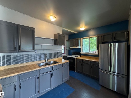 10719 74 Avenue, Edmonton, AB - Indoor Photo Showing Kitchen With Double Sink