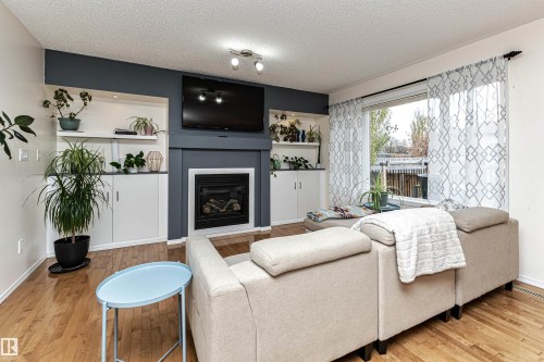 38 Rue Bouchard, Beaumont, AB - Indoor Photo Showing Living Room With Fireplace