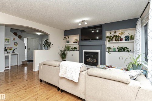 38 Rue Bouchard, Beaumont, AB - Indoor Photo Showing Living Room With Fireplace