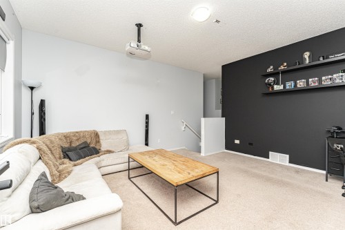 38 Rue Bouchard, Beaumont, AB - Indoor Photo Showing Living Room