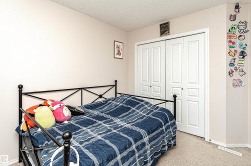 38 Rue Bouchard, Beaumont, AB - Indoor Photo Showing Bedroom