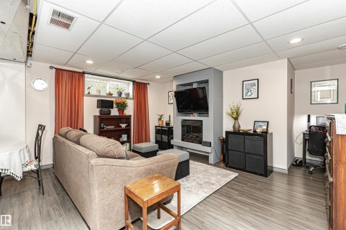 38 Rue Bouchard, Beaumont, AB - Indoor Photo Showing Living Room With Fireplace