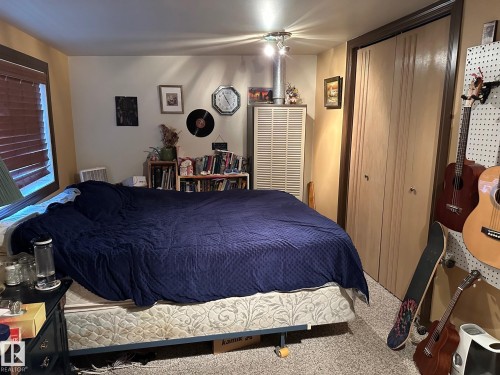 Bedroom featuring carpet floors and a closet - 37 43 Avenue, Millet, AB - Indoor Photo Showing Bedroom
