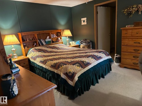 Bedroom featuring light colored carpet - 37 43 Avenue, Millet, AB - Indoor Photo Showing Bedroom