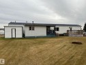 Back of property featuring roof with shingles, a lawn, and a wooden deck - 37 43 Avenue, Millet, AB  - Outdoor 