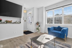 Living area featuring wood finished floors - 