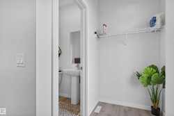 Washroom featuring light wood finished floors and baseboards - 