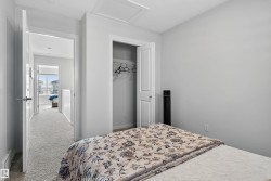 Bedroom featuring carpet, a closet, and attic access - 