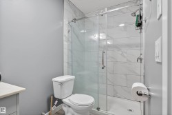 Bathroom with vanity and a stall shower - 