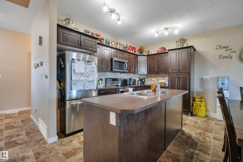 656 Songhurst Wynd, Leduc, AB - Indoor Photo Showing Kitchen With Double Sink