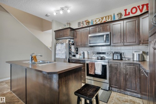 656 Songhurst Wynd, Leduc, AB - Indoor Photo Showing Kitchen With Double Sink