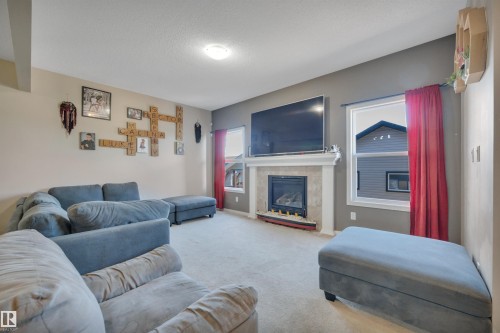 656 Songhurst Wynd, Leduc, AB - Indoor Photo Showing Living Room With Fireplace