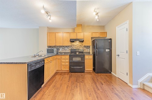 150 5604 199 Street, Edmonton, AB - Indoor Photo Showing Kitchen With Double Sink