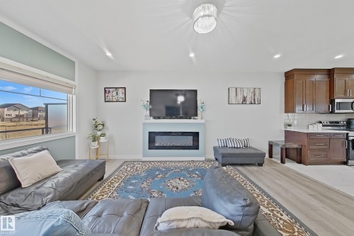 2 2803 14 Avenue, Edmonton, AB - Indoor Photo Showing Living Room With Fireplace