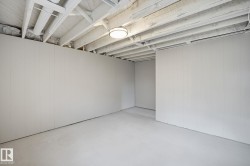 Finished basement with wooden walls - 