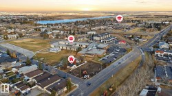 Aerial overview of property's location featuring a nearby body of water - 