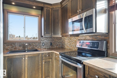 4403 48A Street, Leduc, AB - Indoor Photo Showing Kitchen With Double Sink